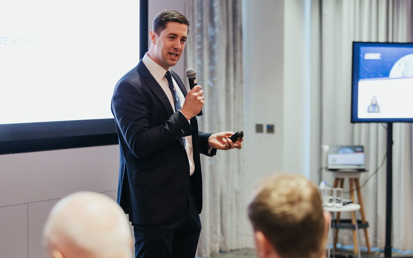 Thomas Hudson speaking to an audience of founders and investors